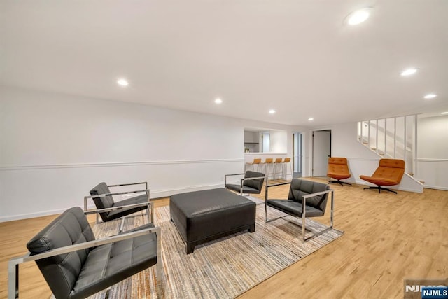 sitting room with recessed lighting, baseboards, and light wood-style floors