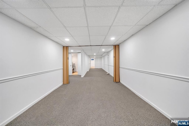 finished basement featuring recessed lighting, carpet, baseboards, and a drop ceiling