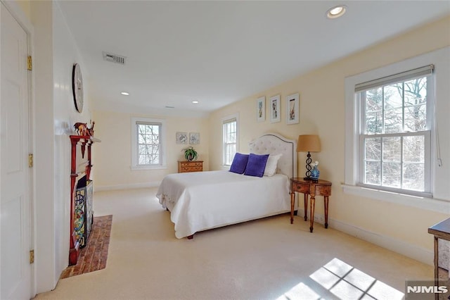 bedroom featuring recessed lighting, visible vents, baseboards, and carpet