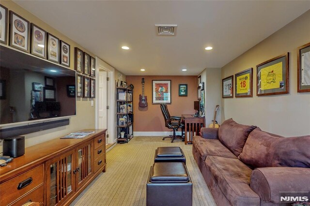 living room with light carpet, visible vents, recessed lighting, and baseboards