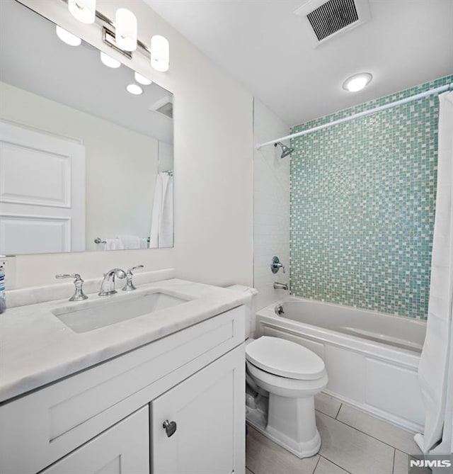 bathroom with tile patterned floors, visible vents, toilet, shower / tub combo, and vanity