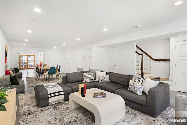 living area featuring stairway and recessed lighting