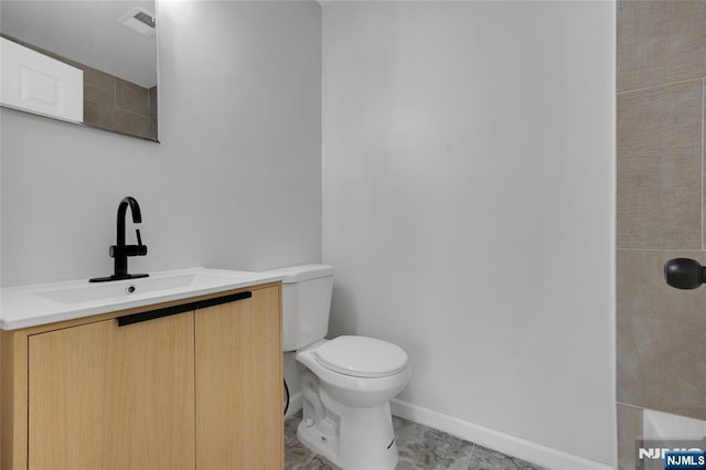 bathroom featuring visible vents, baseboards, toilet, and vanity