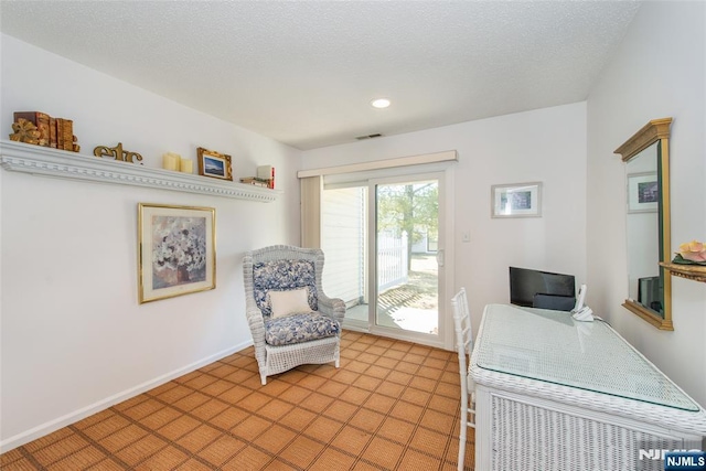 office with recessed lighting, a textured ceiling, and baseboards