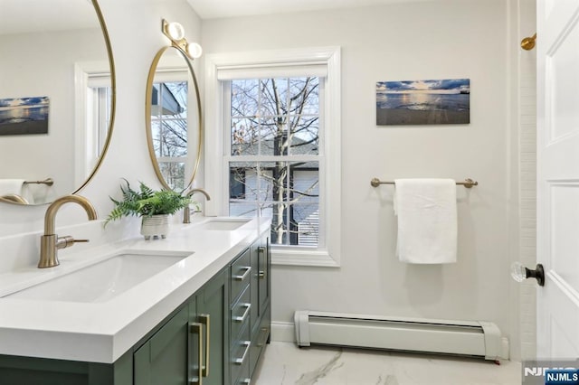 bathroom with a sink, a baseboard heating unit, marble finish floor, and double vanity