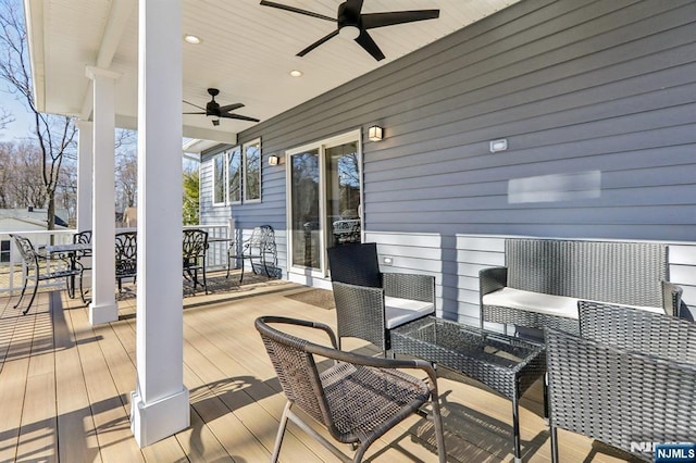 deck featuring outdoor dining space and ceiling fan