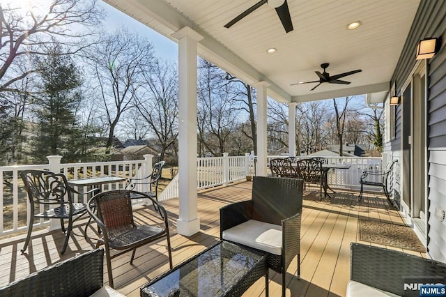 deck featuring outdoor dining space and ceiling fan