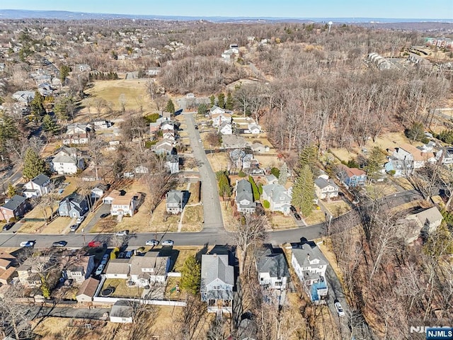 birds eye view of property with a residential view