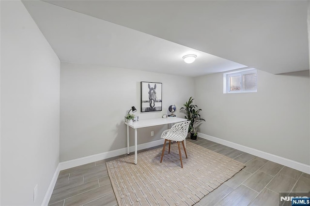 office with baseboards and wood finish floors