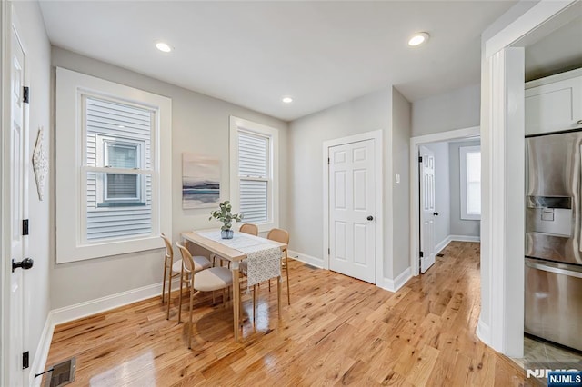 dining room with recessed lighting, visible vents, baseboards, and light wood finished floors