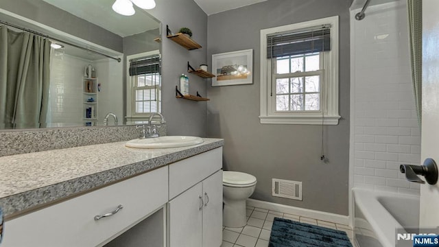 full bath with a wealth of natural light, visible vents, toilet, and tile patterned flooring