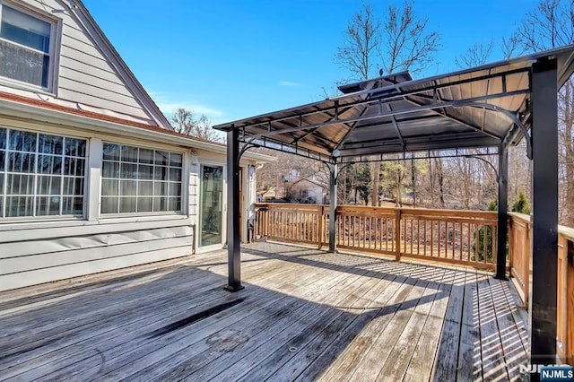 wooden terrace with a gazebo