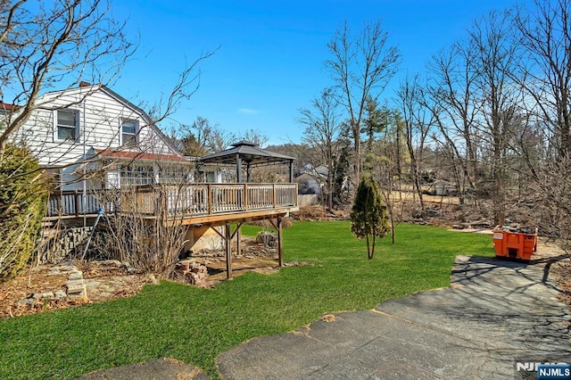 view of yard featuring a gazebo and a wooden deck