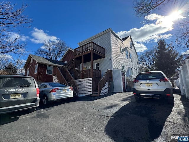 exterior space featuring stairway and a balcony