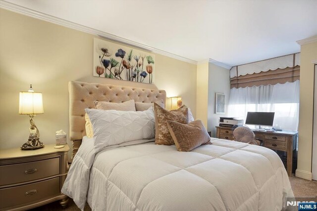 carpeted bedroom with ornamental molding