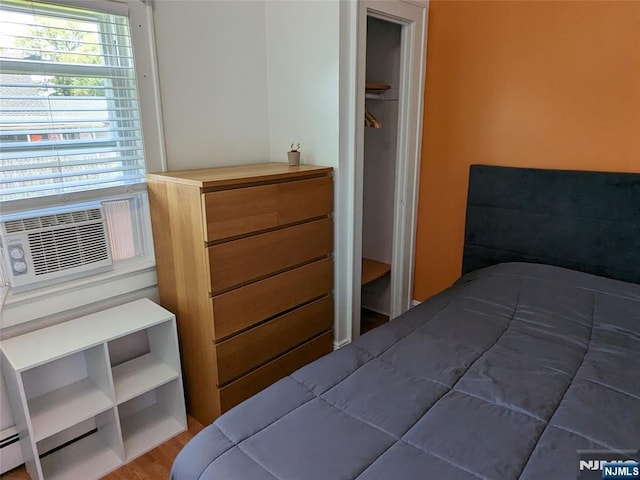 bedroom featuring wood finished floors