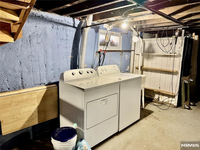 washroom featuring independent washer and dryer and laundry area