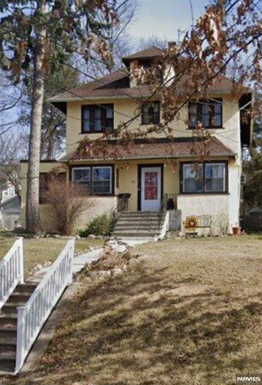 view of front of house featuring stucco siding