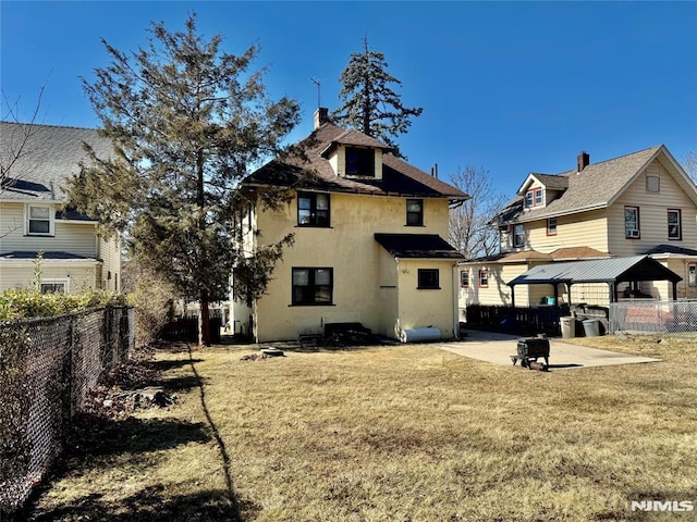 back of property with a patio, a yard, a fenced backyard, a shingled roof, and stucco siding