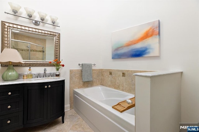 full bathroom with tile patterned flooring, a shower stall, vanity, and a garden tub