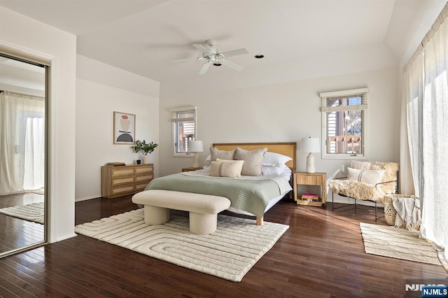 bedroom with baseboards, a ceiling fan, and hardwood / wood-style flooring