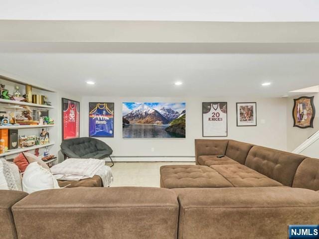 living area with baseboard heating and recessed lighting