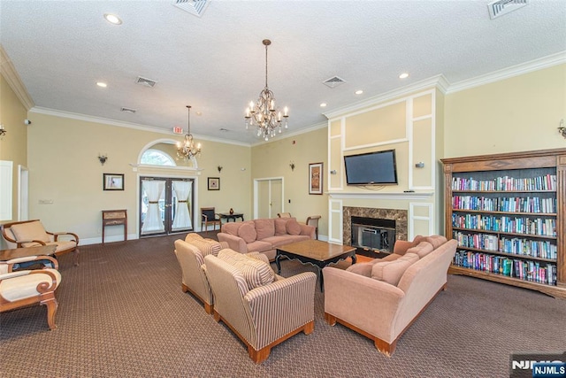 carpeted living room featuring visible vents, a textured ceiling, and a premium fireplace