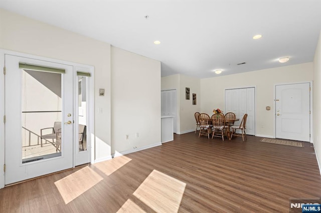 interior space with recessed lighting, visible vents, baseboards, and wood finished floors