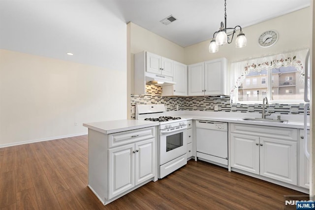 kitchen featuring white appliances, visible vents, a sink, light countertops, and under cabinet range hood