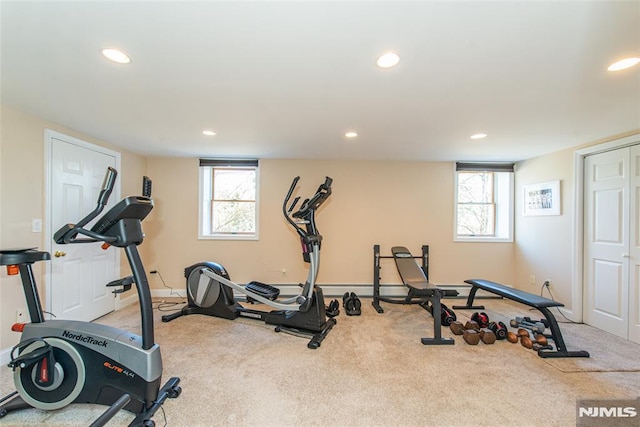 exercise room featuring recessed lighting, a wealth of natural light, and carpet floors