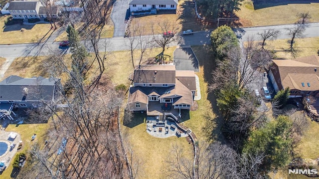 birds eye view of property with a residential view