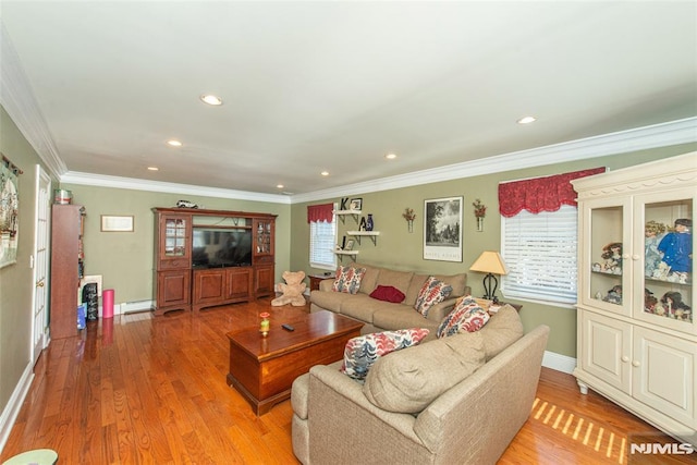 living area featuring a baseboard radiator, recessed lighting, light wood-type flooring, and ornamental molding