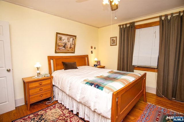 bedroom featuring ceiling fan and wood finished floors