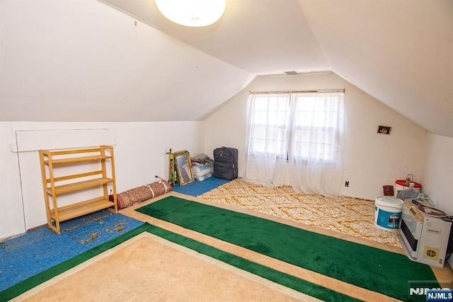 rec room featuring lofted ceiling and carpet floors