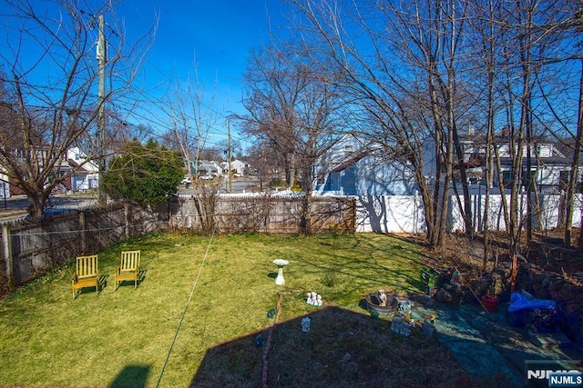 view of yard featuring a fenced backyard