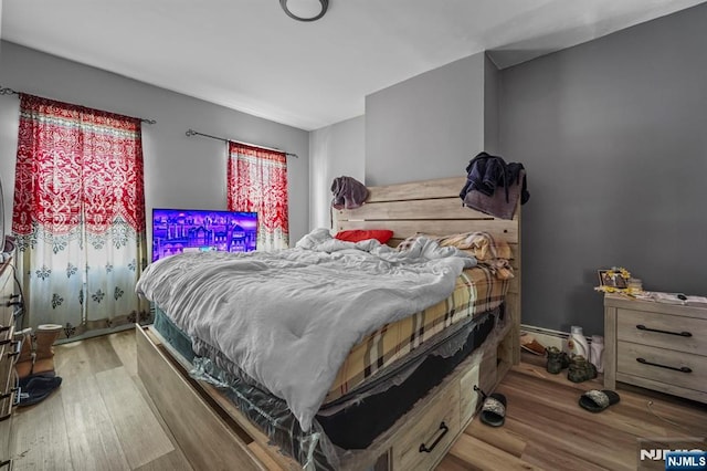 bedroom featuring wood finished floors