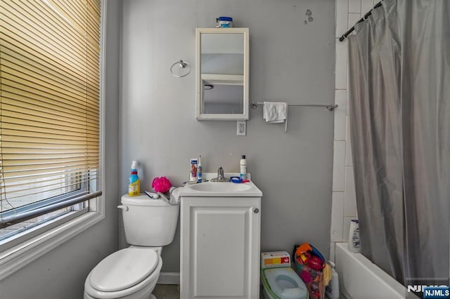 bathroom featuring shower / tub combo, toilet, and vanity