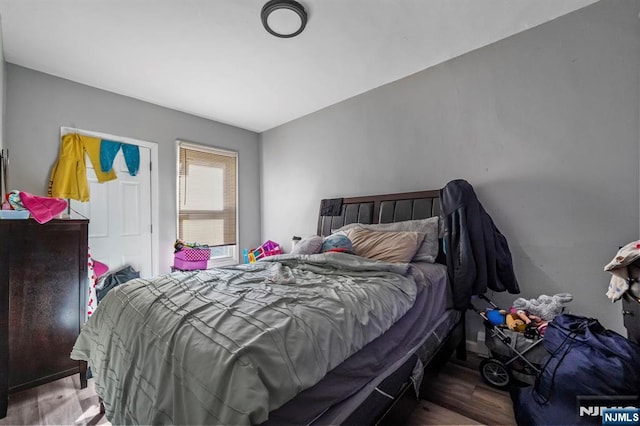 bedroom featuring wood finished floors