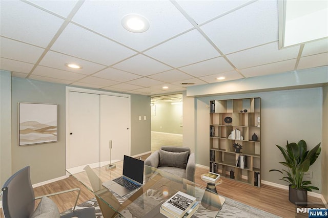 office with recessed lighting, wood finished floors, visible vents, and baseboards