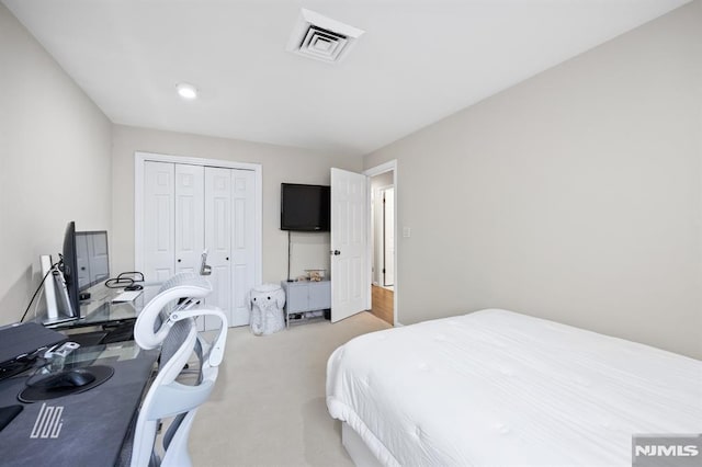 bedroom featuring visible vents and a closet