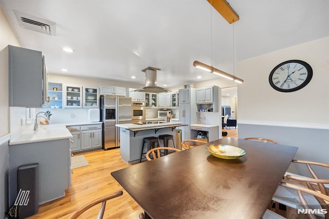 dining space featuring recessed lighting, visible vents, and light wood-style flooring