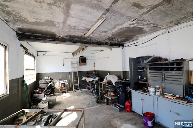 garage with concrete block wall