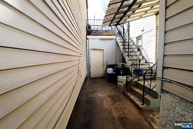 view of home's exterior featuring stairs