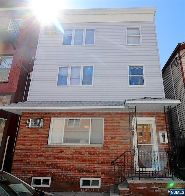 view of front of home featuring brick siding