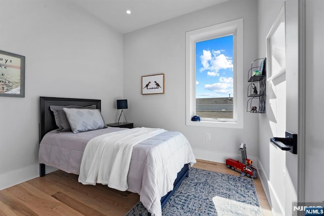 bedroom featuring recessed lighting, baseboards, and wood finished floors