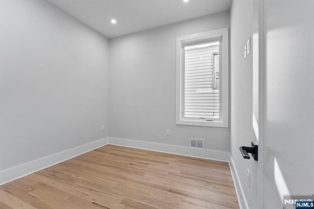 empty room with recessed lighting, visible vents, baseboards, and light wood-style floors