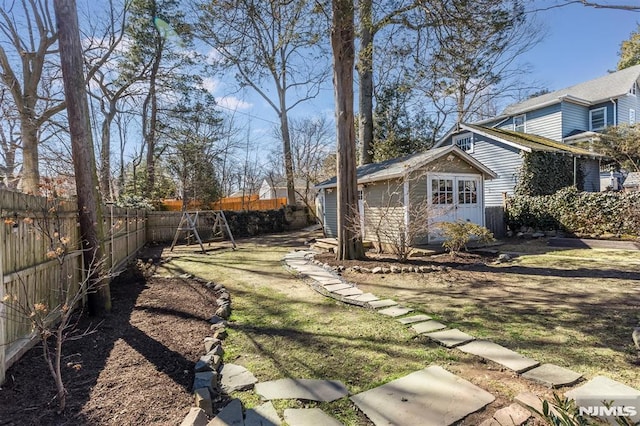 view of yard with an outbuilding and a fenced backyard