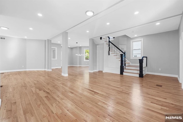 interior space featuring visible vents, light wood-style flooring, recessed lighting, stairway, and baseboards