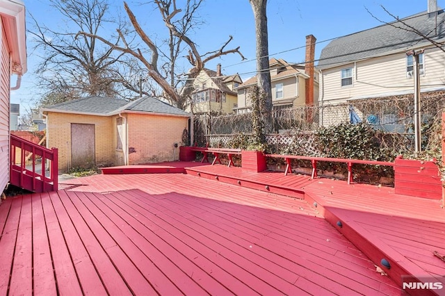 deck with fence and a residential view