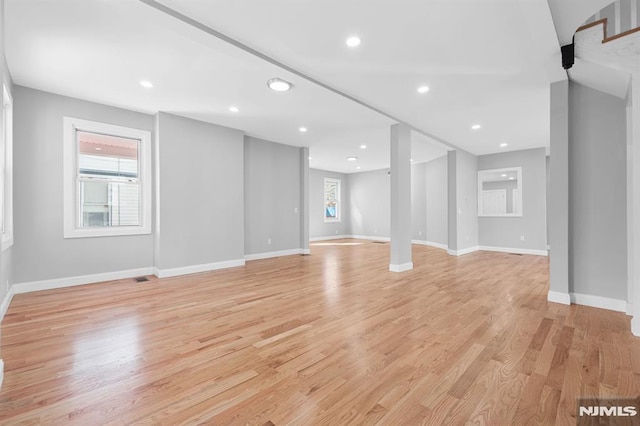 unfurnished living room featuring recessed lighting, visible vents, baseboards, and light wood-style flooring